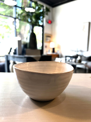 Organic shaped, white-beige bowl with ribbed texture
